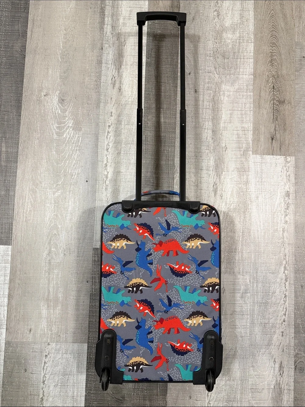 Amazon Kids Rolling Luggage with Red, Blue, Teal & Tan Dinosaur Print